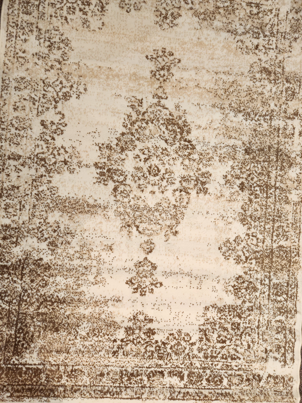 Kalora's Faira 3733/7933 Area Rug: Beige/brown, vintage pattern with faded floral design and boho-style symmetrical border.