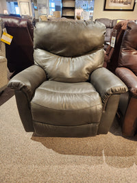 A large, dark brown La-Z-Boy 521 James Power Leather Rocker Recliner with a bucket seat in a showroom.