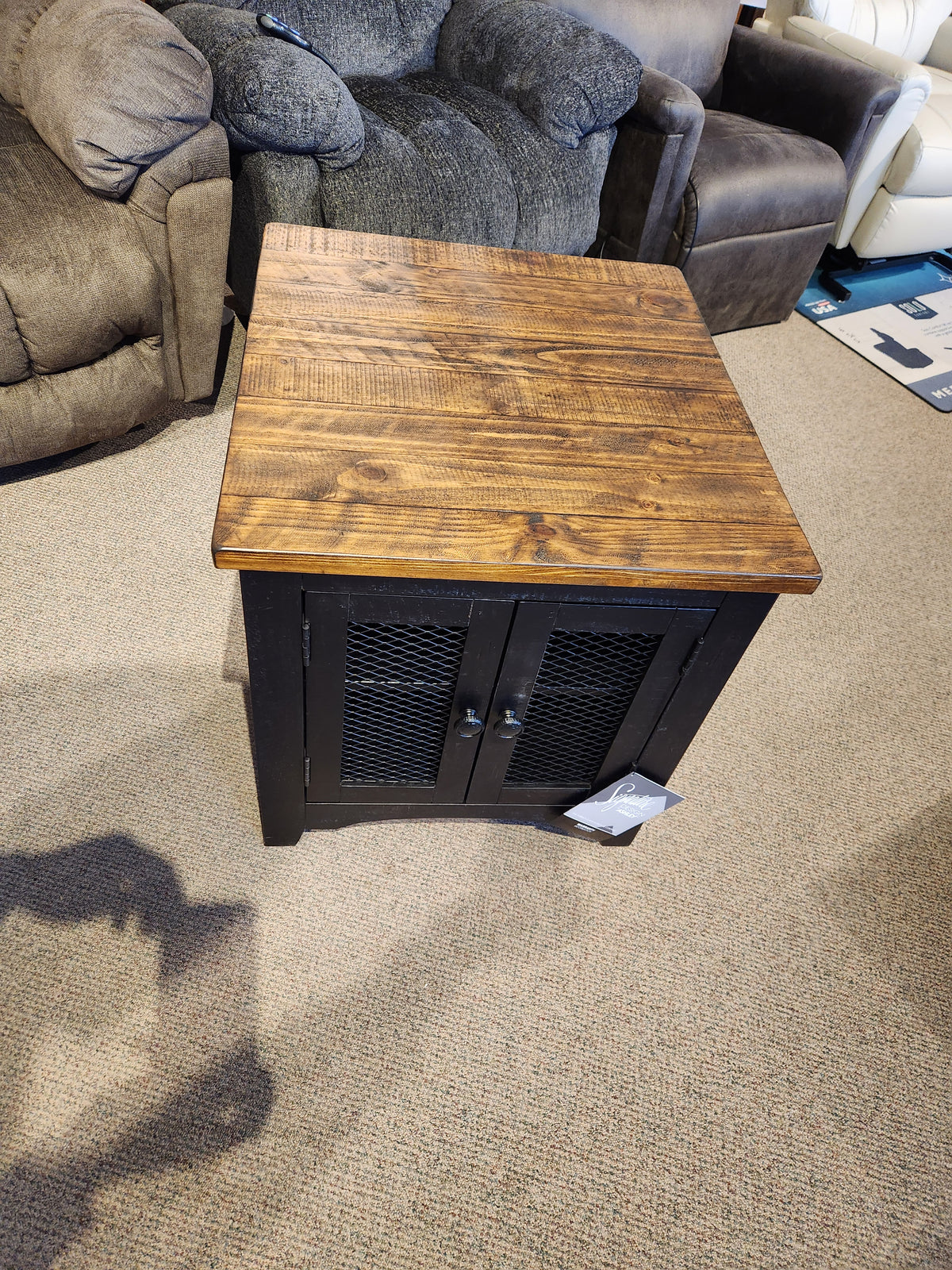 Ashley Valebeck Rectangle T468 End Table with a rustic farmhouse style and wire mesh door fronts complements any decor.