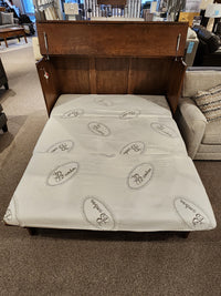 In showroom: Freestanding Cabinet Bed Harrison Elite by Cabinet Bed Inc with bamboo-pattern mattress and chic furniture.