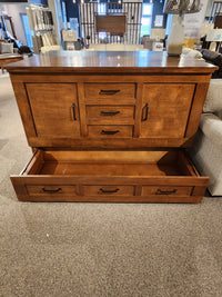 A Cabinet Bed Harrison Elite Series by Cabinet Bed Inc, featuring one large open drawer and three smaller ones above.