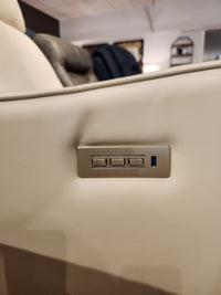 Close-up of the armrest on the Palliser Oakridge 40180-C1 Power Chair, crafted from beige leather with three rectangular buttons and an embedded USB port, highlighting its upscale appeal.