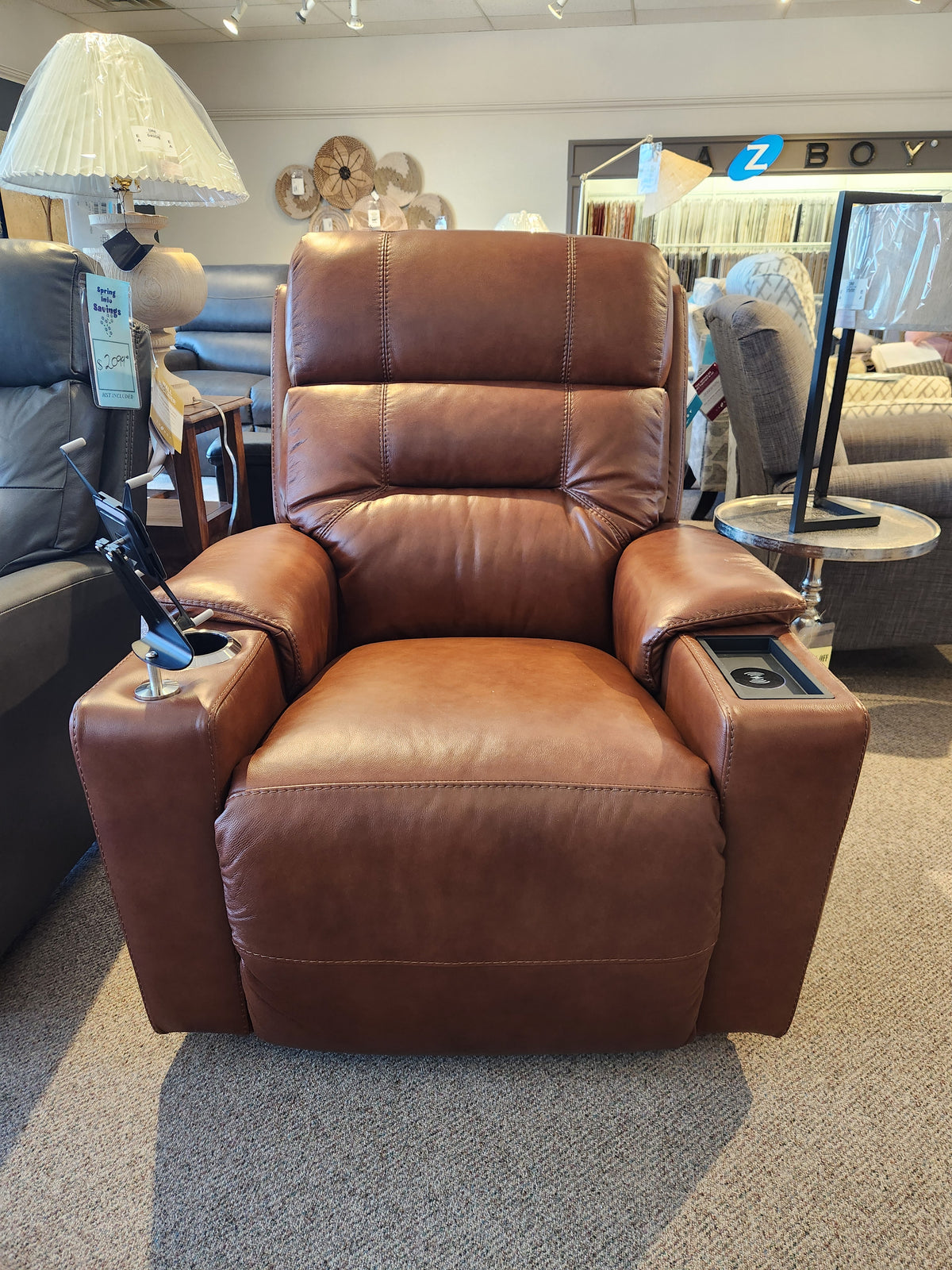 La-Z-Boy 762-16X Neo Recliner in brown leather offers cup holders, a USB port, and adjustable headrest in the showroom.