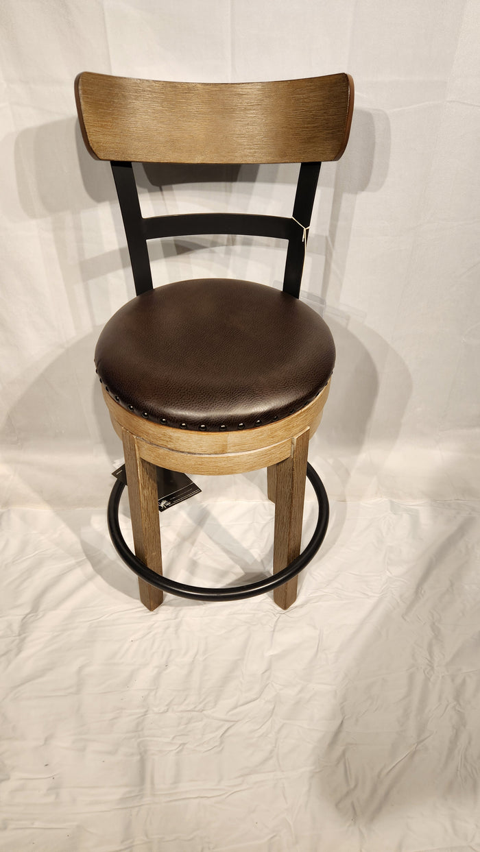 Ashley D542 Pinnadel counter height stool with faux leather seat and metal footrest on a white background.