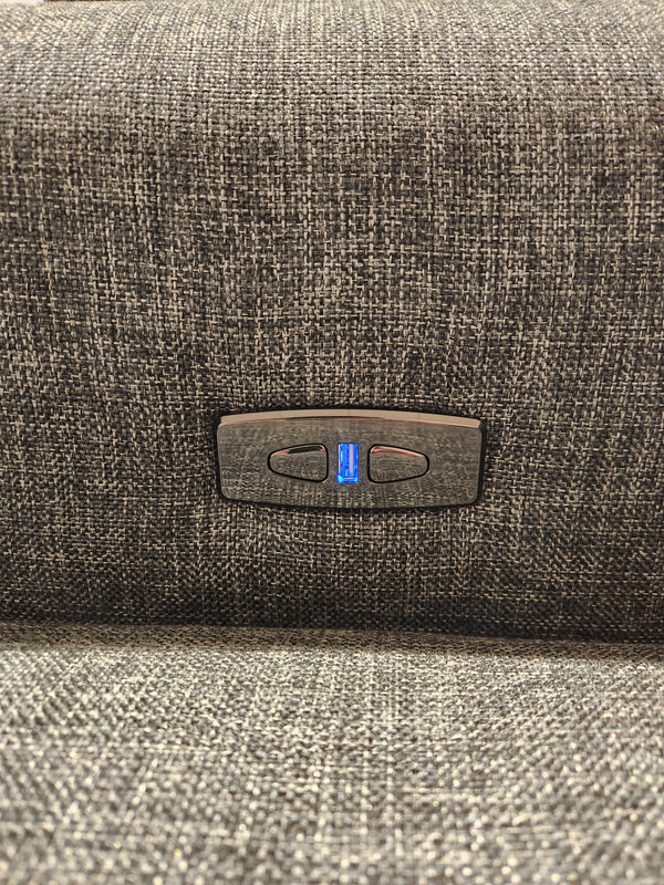 Close-up of the Decor-rest 2179 Power Loveseat, a Canadian fabric-covered seating option with a control panel featuring two buttons and a USB port, highlighting exquisite upholstery details.