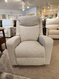 A 781 Emmons Rocker Recliner by La-z-boy in gray offers comfort in a showroom filled with similar cozy recliners.