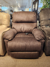 The Best Ellisport 7MP84 Power Space Saver Recliner, showcasing a plush back and seat with padded armrests, is on display in a furniture store, delivering the ultimate in comfort.