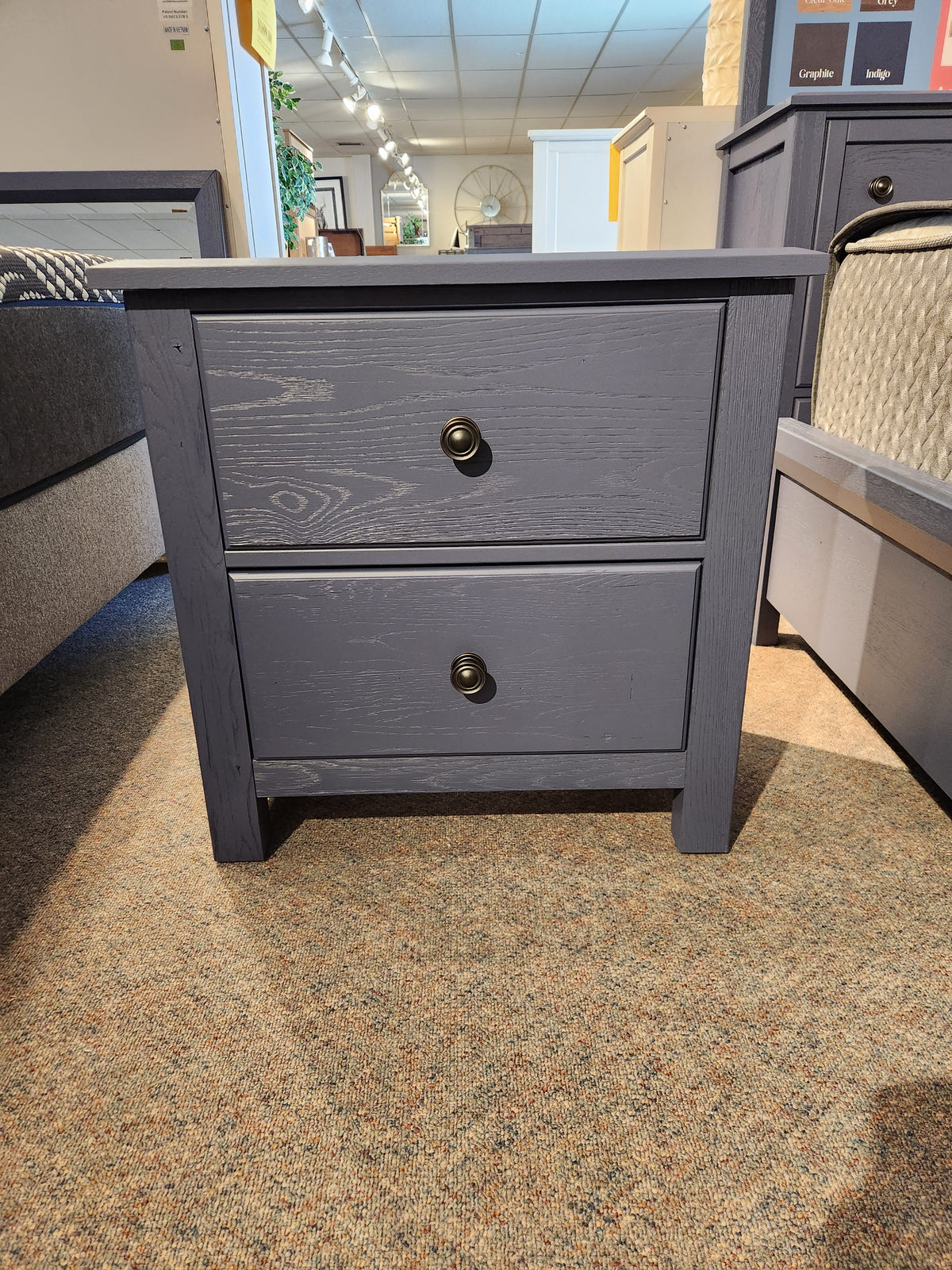 A 126 Artisan & Post 2-drawer nightstand by Vaughan Bassett in solid American White Oak, displayed on carpet.