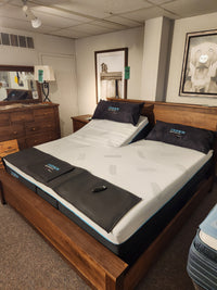 Bella Vita Plush 12" Split Mattress by Fashion in a showroom with an adjustable base, head articulation, and dark pillows.