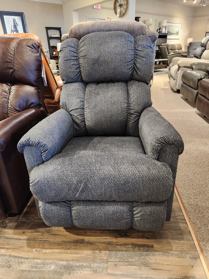 The La-Z-Boy 512 Pinnacle Wall-a-Way, a plush gray recliner chair offering exceptional comfort, is proudly made in America and displayed in a furniture store showroom.