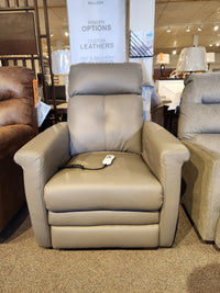 The Granville 40183-B2 Power Lift Chair by Palliser is a stylish grey leather recliner that offers exceptional comfort and convenience with its seat-mounted remote control. Now on display in our furniture store, it makes an ideal addition to any living space.