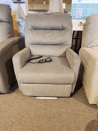 Davida 2AZ53 Power Lift Chair by Best, in grey fabric, includes a remote and is shown with other furniture in the showroom.