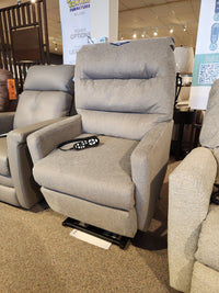 Davida 2AZ53 Power Lift Chair by Best in gray with remote, displayed in a showroom.