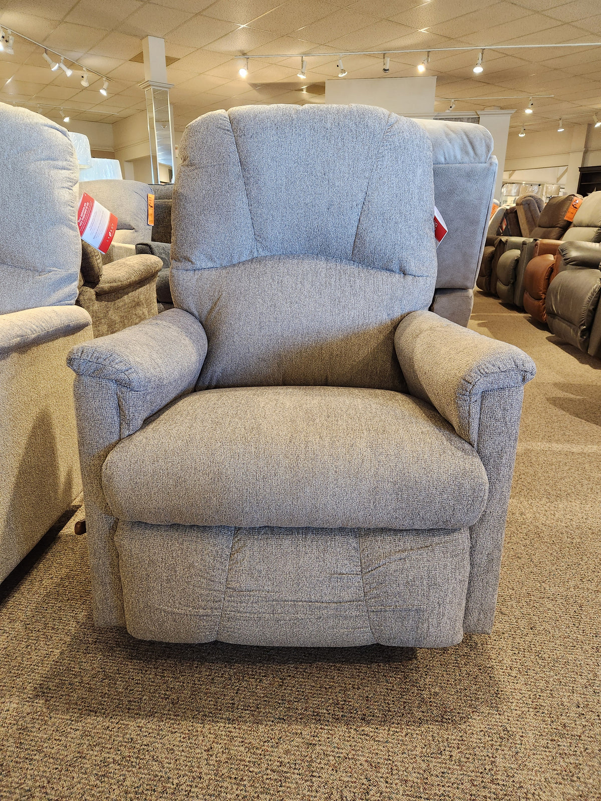 La-Z-Boy 795 Mercury Rocker Recliner on display for comfort and relaxation among similar chairs in a showroom.