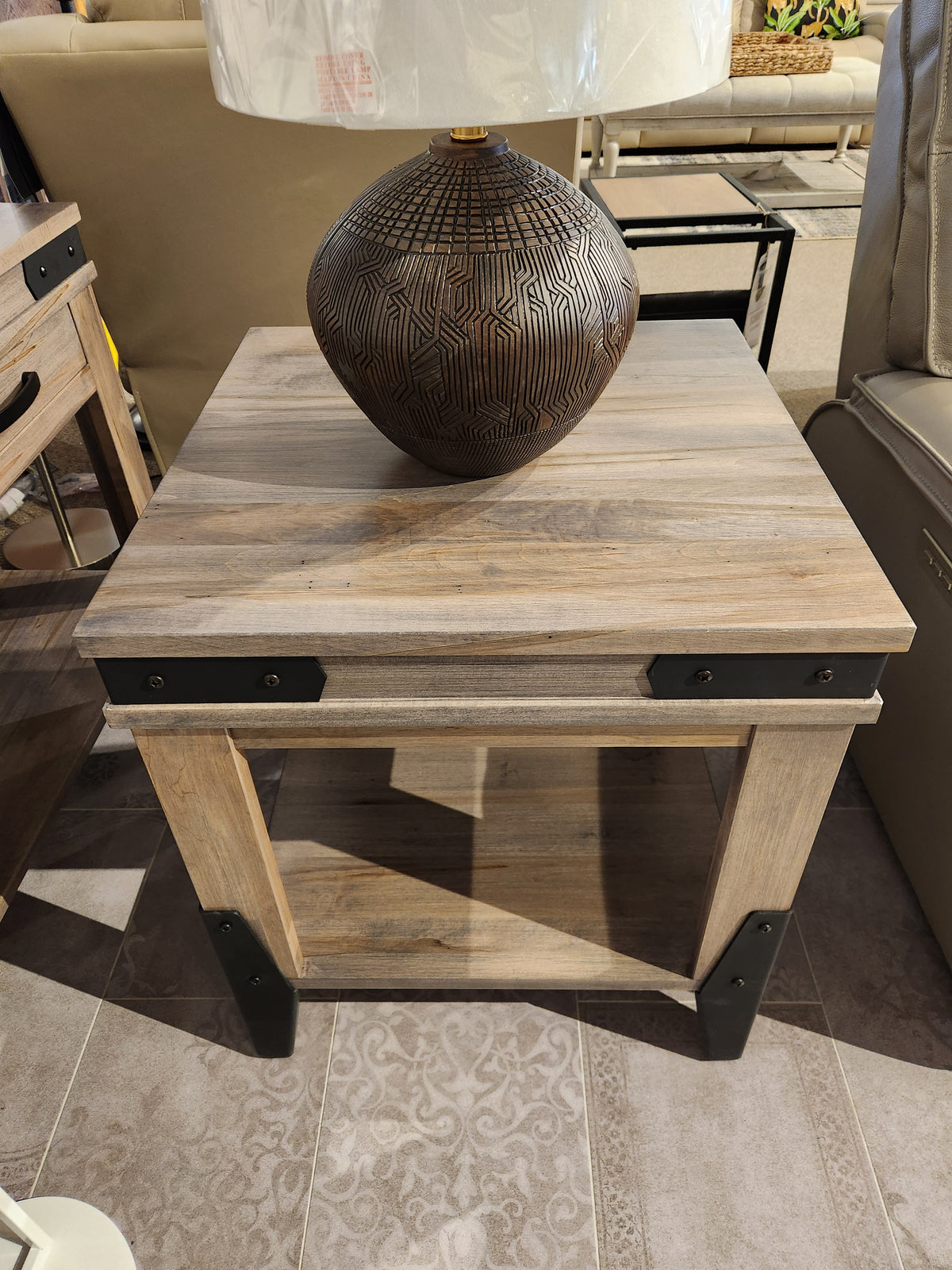 Handstone's N-CH23X Chattanooga Table has a metal frame with a ceramic lamp on top.