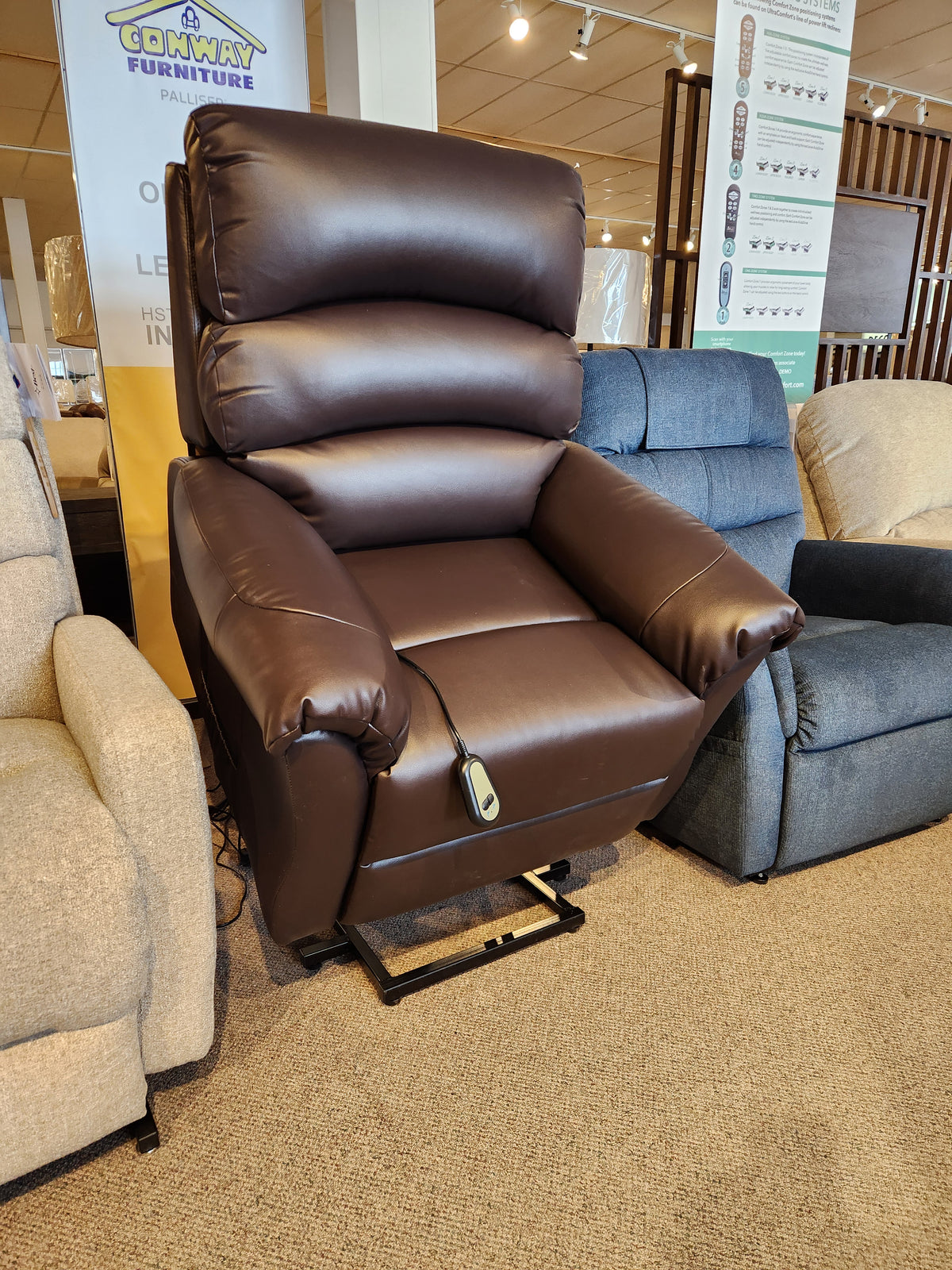 Primo Fresna Power Lift Chair displayed in-store, featuring a remote control on the armrest.