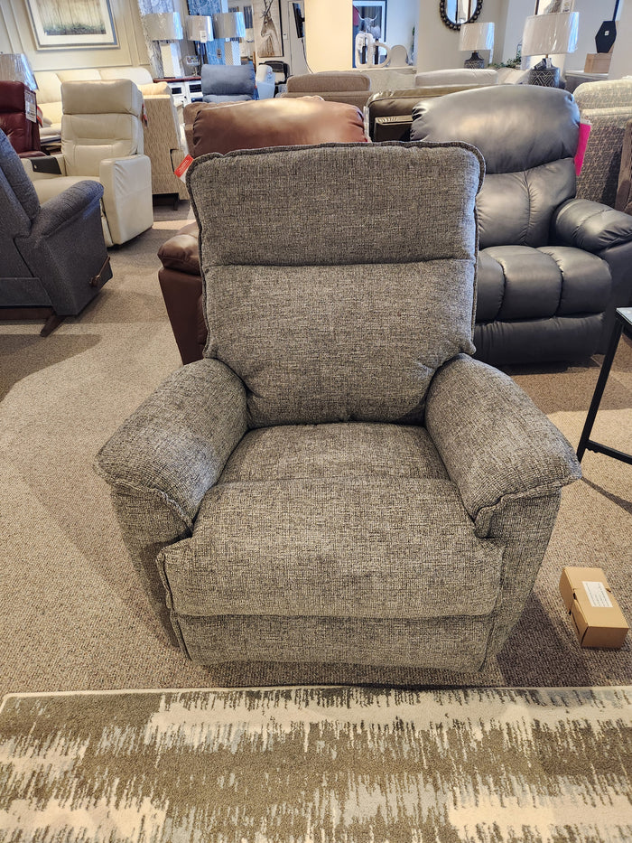 La-z-boy's 706 Jay Power Rocker Recliner displayed in a store showcases casual style and comfort with other chairs behind.