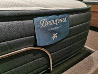 Close-up of a Beauty-rest Anchorage TT Mattress label, highlighting its promise of restorative sleep in a store setting.