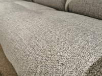 Close-up of textured gray fabric on the Best S650RZ4 Derek Power Sofa cushion, showing detailed stitching and color variations.