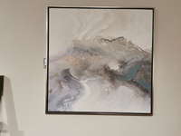 A large CVTOP3322 Galloway Canvas Painting Set by Crestview Collection, featuring swirling gray, white, and sepia tones with gold and silver embellishments, is displayed on an off-white wall.