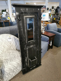 The Woodcraft 710 Doorganizer, a handmade black distressed mirror featuring hooks and a pocket, crafted with care in Ontario, is charmingly showcased in a furniture store setting and priced at $169.99.