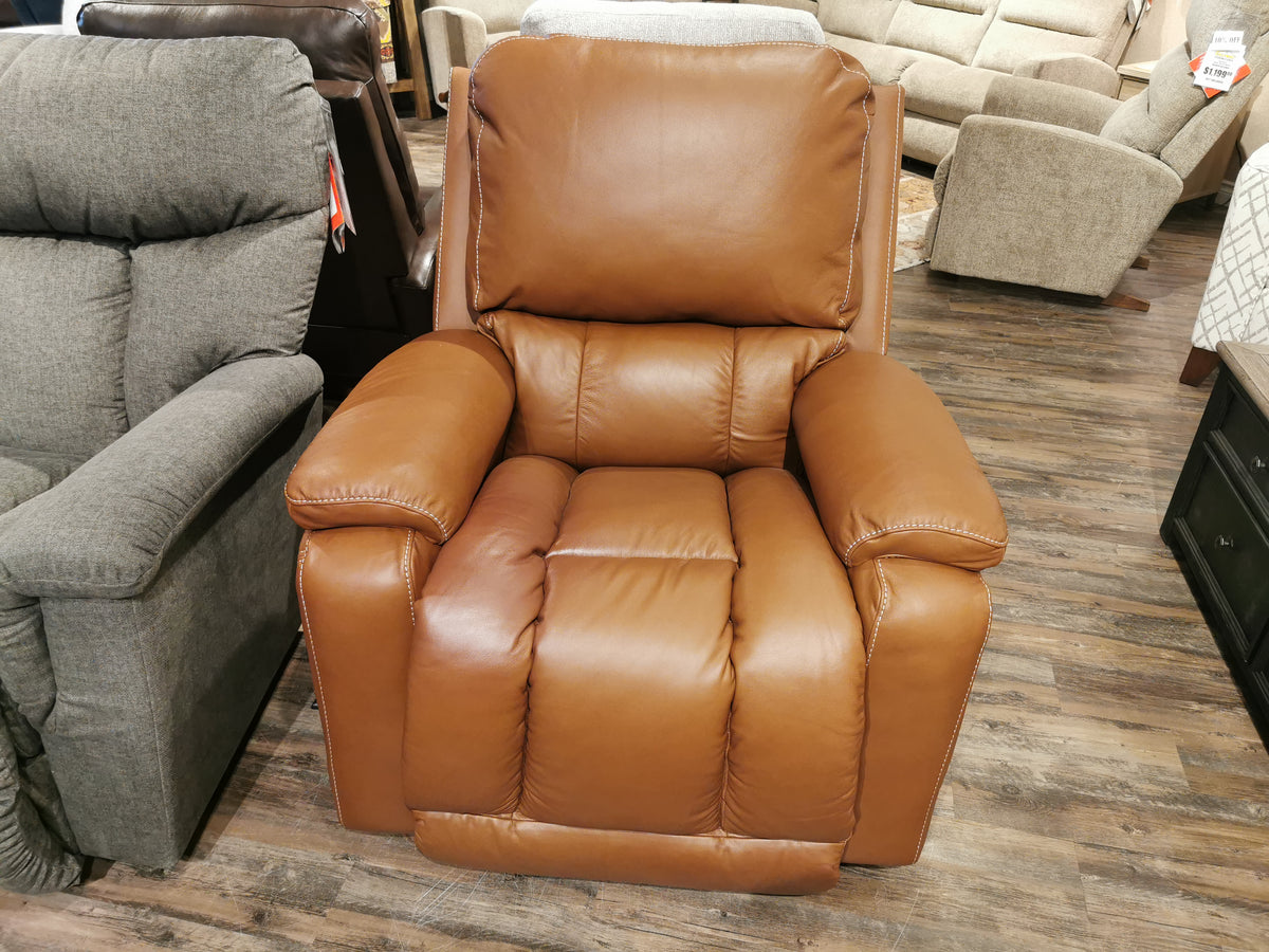 A La-Z-Boy 530 Greyson Rocker Recliner with power sits on a wooden floor, surrounded by other upholstered chairs.