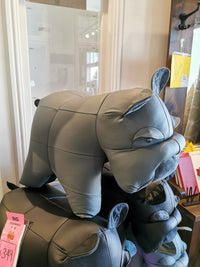 On display in the store is a handcrafted gray ottoman shaped like a bulldog and made from real leather, known as Reiner's Leather Animal Ottomans by Reiner's Originals, priced at $349 with a clearance tag.