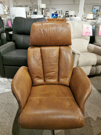 The Vilma Recliner with Ottoman, crafted from Italian leather and featuring the innovative Motion Italia mechanism, is elegantly displayed in a furniture store setting under the Donald Choi brand.