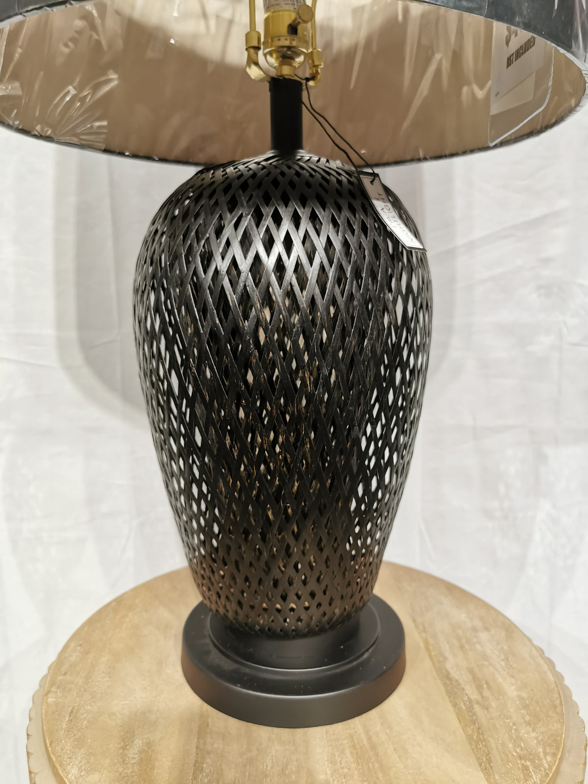 Crestview Collection's Rattan Table Lamp features a black lattice and dark shade, ideal for modern interiors.