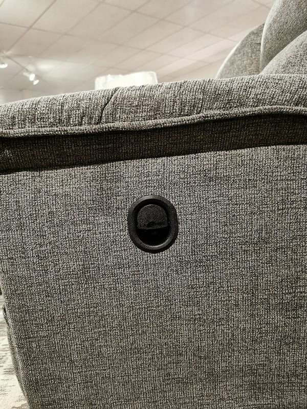 Close-up of the 706 Jay Sofa's textured fabric side featuring La-z-boy's circular reclining button for personalized comfort.