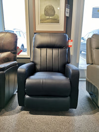 La-Z-Boy's 747-10 Finley black leather recliner set in a room with large windows and framed artwork.