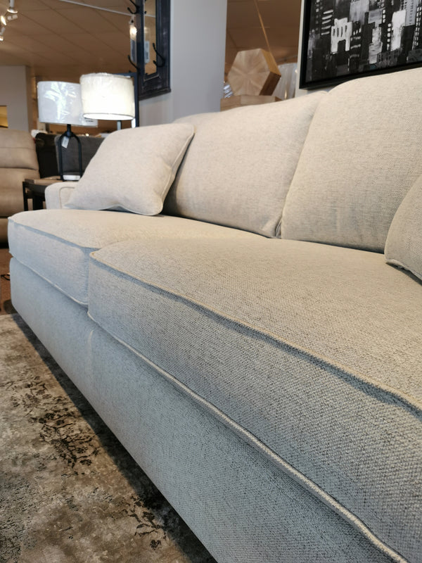 A La-Z-Boy 663 Paxton Sofa with ComfortCore cushions in light gray offers deep seating on a patterned rug.