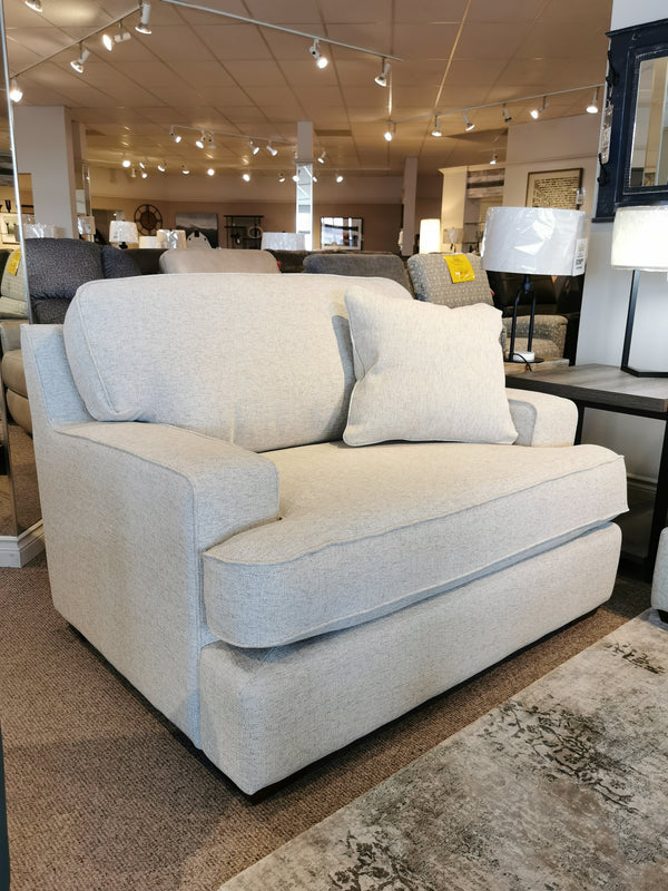 Light gray 663 Paxton Chair & 1/2 by La-z-boy, ideal for lounging with cushion, among stylish furnishings.