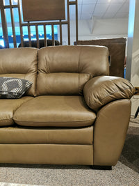 The Palliser 77343 Amisk Sofa in brown leather and patterned cushions offers stylish, comfy seating for any showroom.