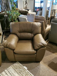 The Palliser 77343 Amisk Chair in brown leather offers lounge-like comfort in a furniture store showroom.