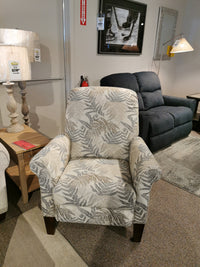 424 Fletcher Power Hi-Leg Recliner by La-Z-Boy with a leaf pattern, shown in a showroom with furniture and decor.