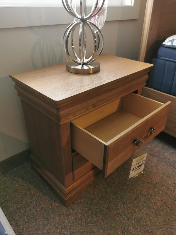 Vaughan Bassett's 771 Vista Night Stand with 2 drawers features a metallic lamp and visible price tag.