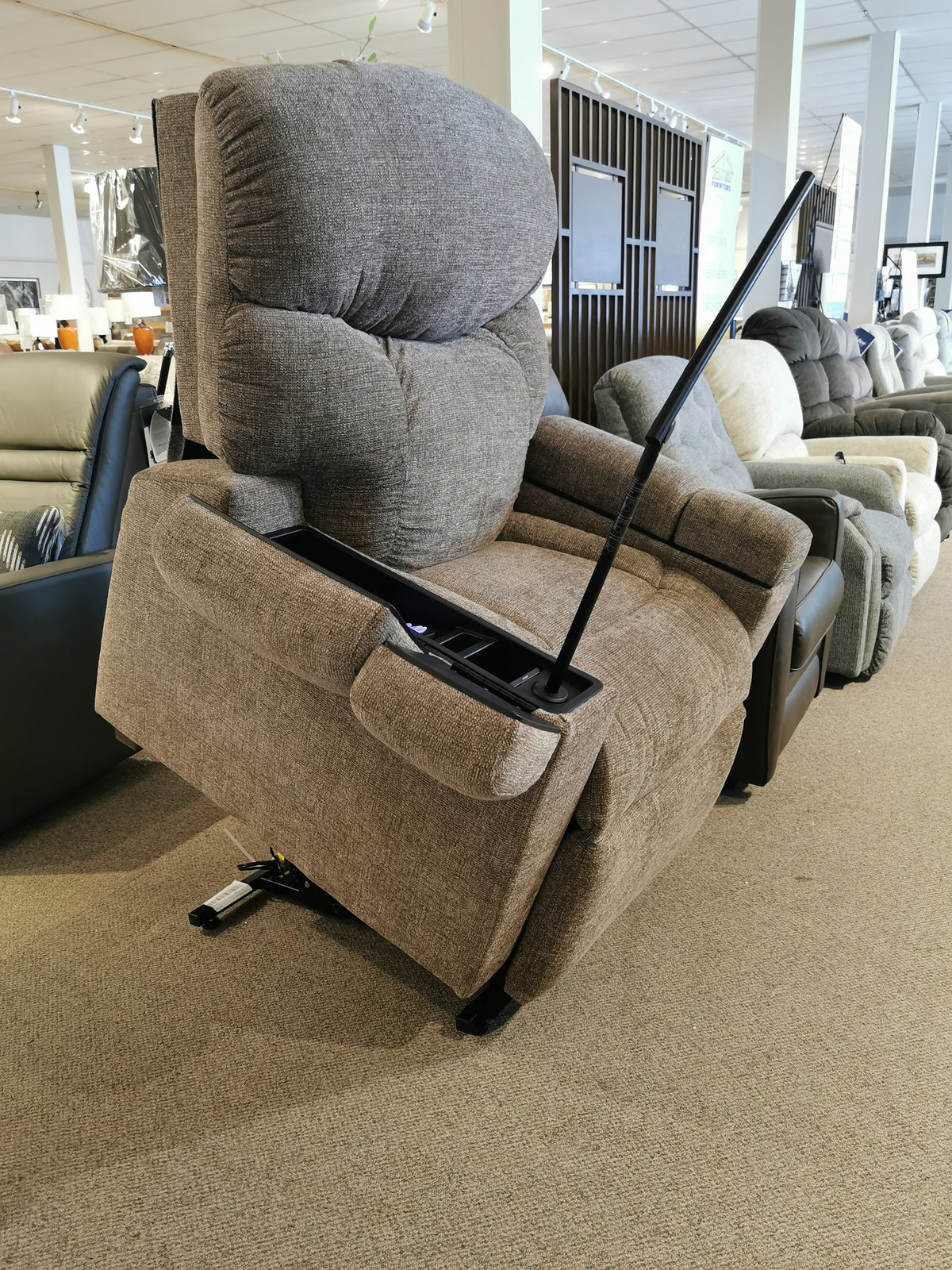 A Maya UC-566 Med Power Lift Chair by Golden with Swedish Air Massage elegantly showcased in a furniture store.