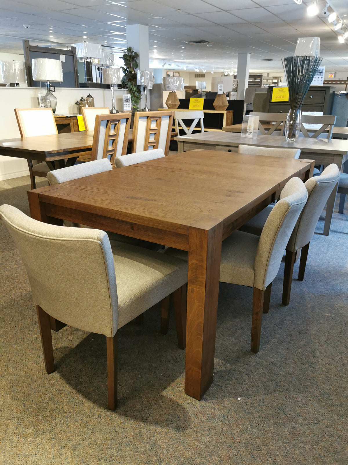 Modern simplicity defines the Bloc Dining Package by Donald Choi with six gray chairs in a solid rubberwood finish.