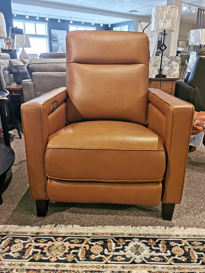 Timberland Power Chair, a brown leather recliner by Aurora Furniture, with power headrest on a rug in store display.