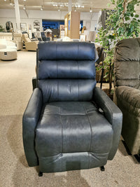 Kristisha 9NZ31LV Power Lift Chair by Best in black leather, modern silhouette, displayed with chairs and greenery.