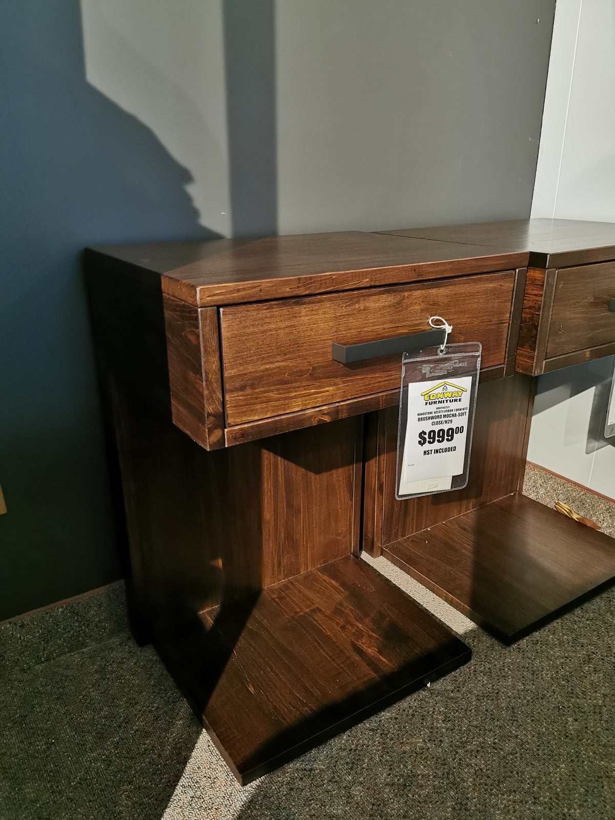 The Handstone AlaCarte Lisbon Nightstand offers modern elegance and storage, priced at $99.99 with a gray and brown design.