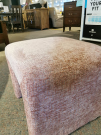 Sophia Petite Bench by Jofran featuring luxe chenille fabric and waterfall sides on a carpeted store floor with wooden accents.