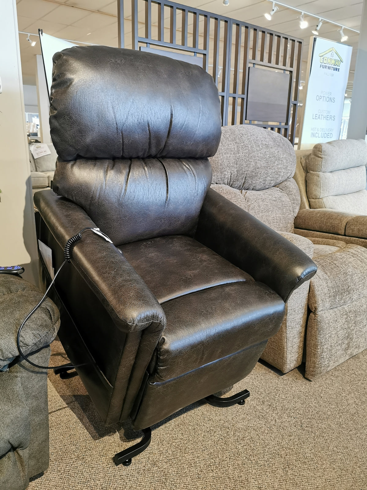 Golden's Austin UC-342 Power Lift Chair, a plush dark brown leather recliner with seam detail, is available in-store.