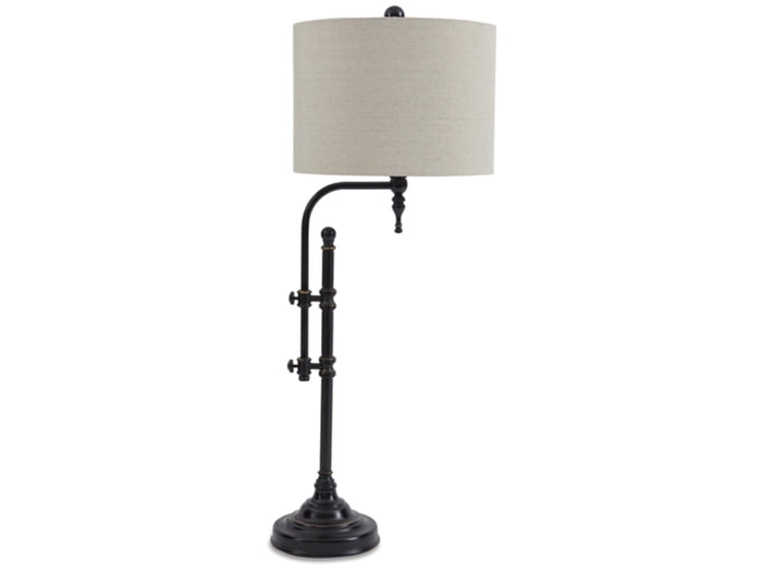 The Anemoon Table Lamp by Ashley showcases a tall black metal frame with an adjustable arm, a sculptural metal base, and a round beige fabric lampshade, providing adaptable lighting for any area.