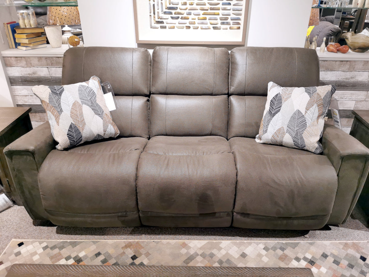 This La-Z-Boy 757 Apollo Reclining Sofa is a gray, three-seat recliner with bucket chaise seats and includes two leaf-patterned cushions, making it an ideal addition to any living room.