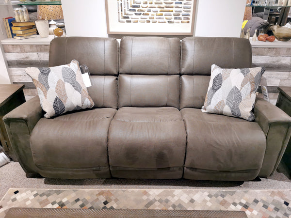 This La-Z-Boy 757 Apollo Reclining Sofa is a gray, three-seat recliner with bucket chaise seats and includes two leaf-patterned cushions, making it an ideal addition to any living room.