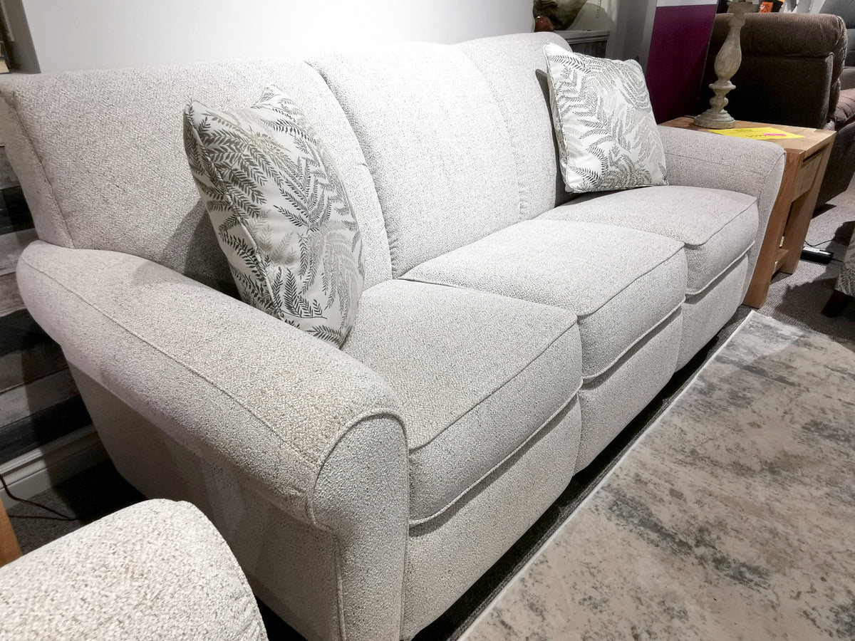 La-Z-Boy 899 Duo Bennett Sofa: light gray upholstery, reclining comfort, three cushions, and patterned pillows on gray carpet.