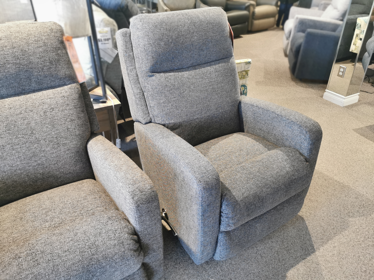 A La-Z-Boy 747 Finley Wall-a-way Recliner, featuring contemporary style and gray upholstery, graces the furniture store showroom.