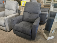 A gray 780 Hawthorn Rocker Recliner by La-z-boy is displayed on a beige carpet next to a mirror.